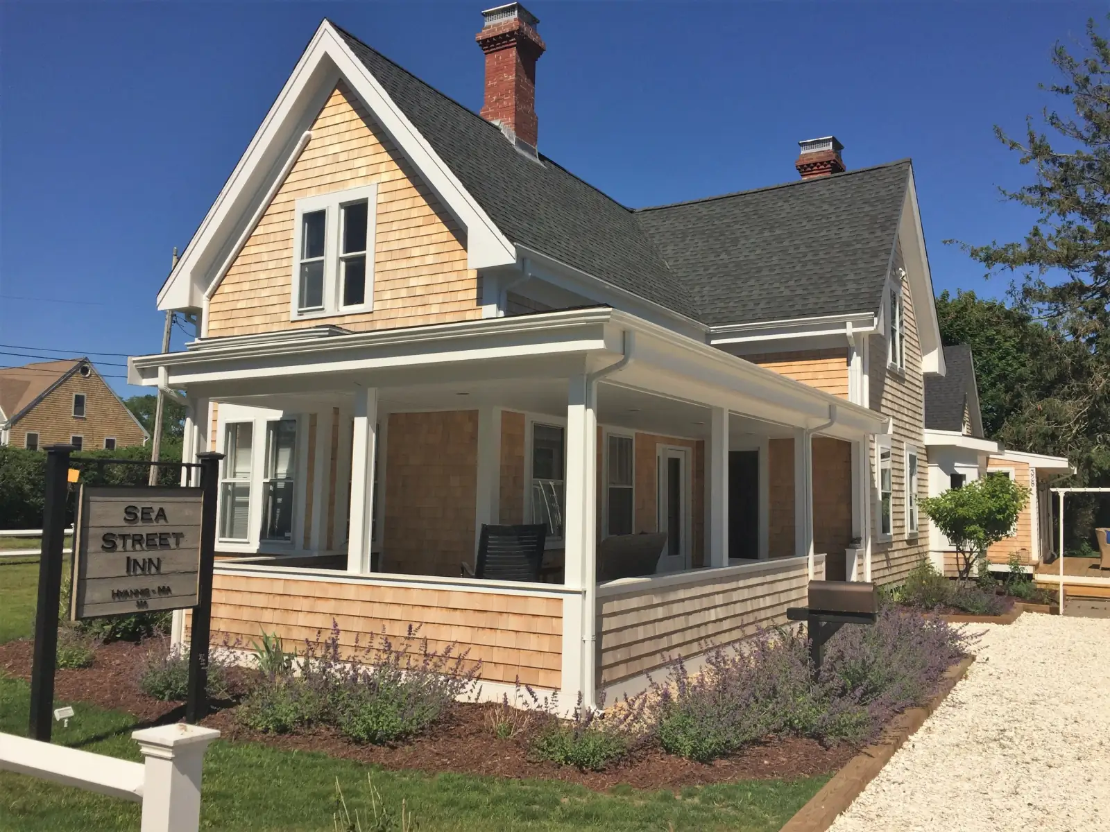 Sea Street Inn, a cedar-shingled Cape Cod inn with a wraparound porch, in Hyannis
