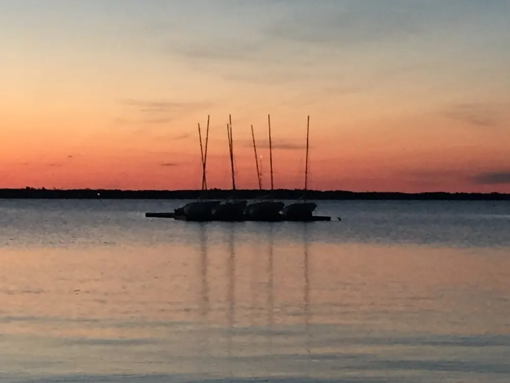 Boats at anchor at sunset in Hyannis