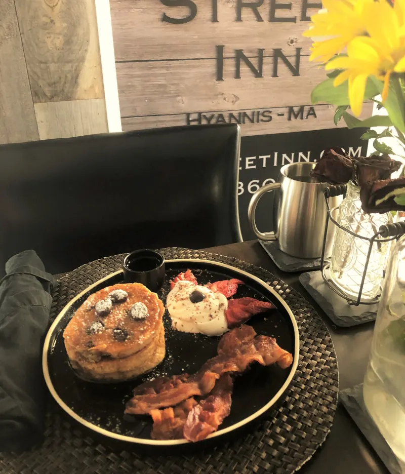 Pancakes with bacon and whipped cream